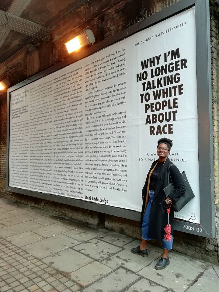 Reni posing in front of a Shoreditch billboard